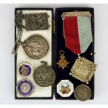A group of mixed silver and other medals.