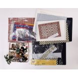 A quantity of dolls house floor coverings and small accessories.