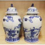 A pair of large Chinese hand painted porcelain jars and lids, H. 51cm.