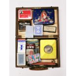 A case of vintage tins, playing cards, etc.