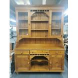 A glazed pine kitchen dresser, 210 x 151 x 44cm.