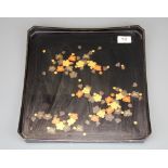 A Japanese lacquer square tray, with canted corners, finely decorated with red and gold painted