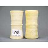 Two 19th C carved ivory dice shakers, H. 9cm.