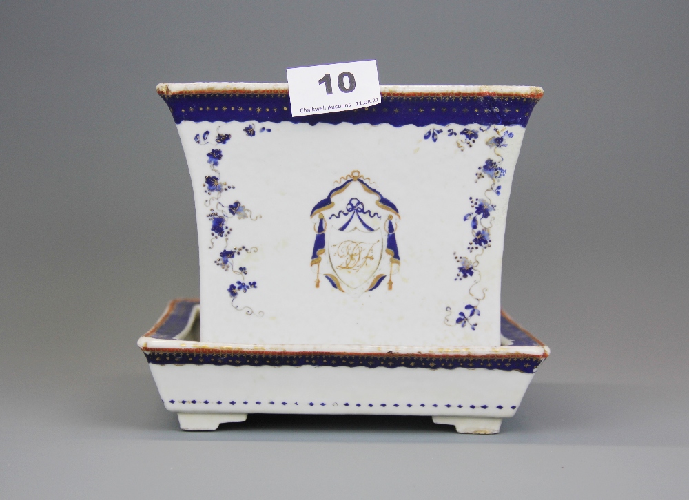 A Chinese export armorial porcelain planter and dish (A/F), H. 15.5cm. W. 18cm.