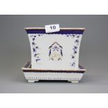 A Chinese export armorial porcelain planter and dish (A/F), H. 15.5cm. W. 18cm.