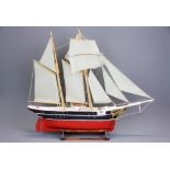 A handmade wooden model of a sailing barge, L. 58cm, H. 47cm.