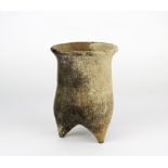 A Neolithic (10,000–4,500 BCE) clay fire pot, H. 14cm, Dia. 10cm. Some museum style restoration.