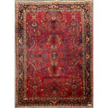 An antique Persian hand woven red ground wool rug, 155x106 cm