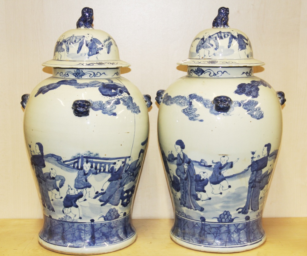 A pair of large Chinese hand painted porcelain jars and lids, H. 51cm.