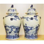 A pair of large Chinese hand painted porcelain jars and lids, H. 51cm.