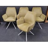 A set of four re-upholstered green 'suede fabric' chairs.