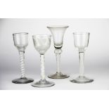 A group of four latticino tall stem liquor glasses, one acid etched but A/F to stem, tallest 17cm.