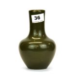 An olive green glazed Chinese porcelain vase, H. 16.5cm. Six character mark to base for Guangxu (