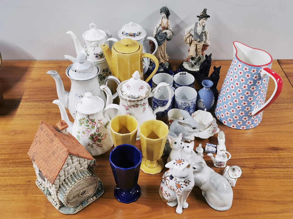 A group of porcelain, coffee pots and other items.