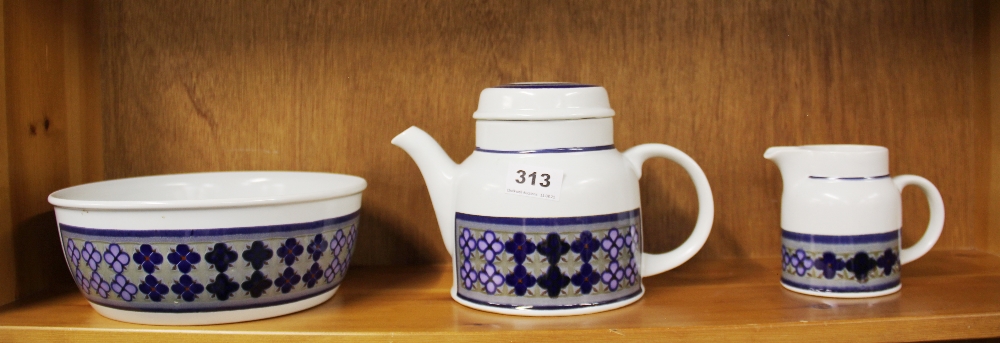 A Royal Doulton stoneware Tangier pattern teapot, milk jug and large fruit bowl.