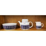 A Royal Doulton stoneware Tangier pattern teapot, milk jug and large fruit bowl.