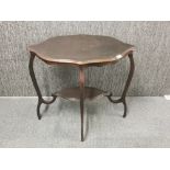 An Edwardian mahogany side table, H. 68cm W. 76cm. Two fretted panels missing.
