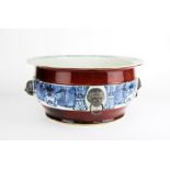 An important large Chinese hand painted porcelain temple basin with copper red body decoration and