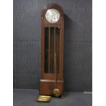 A 1920's oak striking longcased clock, 195 x 23cm.