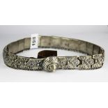 A niello decorated Eastern white metal covered leather belt, L. 60cm. Panel D. 3.5cm.