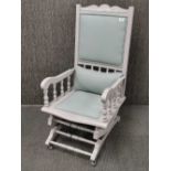 A re-upholstered and re-finished Victorian rocking chair, H. 107cm.