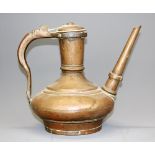 An early Eastern hand made bronze jug, H. 22cm.