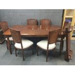 A high quality extending mahogany dining table with two leaves, together with 6 matching mahogany