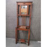 A 1920's oak hat/coat stand, H. 182cm W. 65cm.