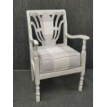 A 1920's re-upholstered and re-finished low chair.