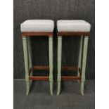 A pair of re-upholstered and re-finished ostrich leather and beechwood stools, H. 80cm.