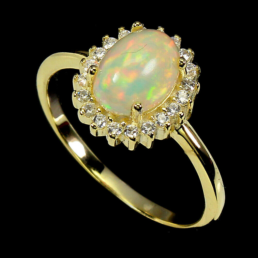 A matching 925 silver gilt cluster ring set with cabochon cut opal and white stones, (N.5). - Bild 2 aus 2