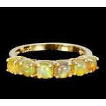 A 925 silver gilt ring set with cabochon cut opals, (P).