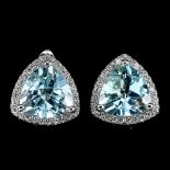 A pair of 925 silver earrings set with trillion cut blue topaz surrounded by white stones, L. 1.