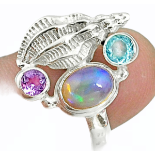 A 925 silver ring set with opal, blue topaz and amethyst, (P).