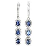 A pair of 925 silver drop earrings set with oval cut sapphires and white stones, L. 5cm.