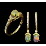 A 925 silver gilt pair of earrings and matching ring, set with cabochon cut opals and white