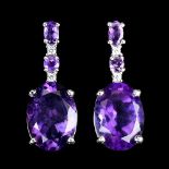 A pair of 925 silver drop earrings set with oval cut amethysts and white stones, L. 2.6cm.