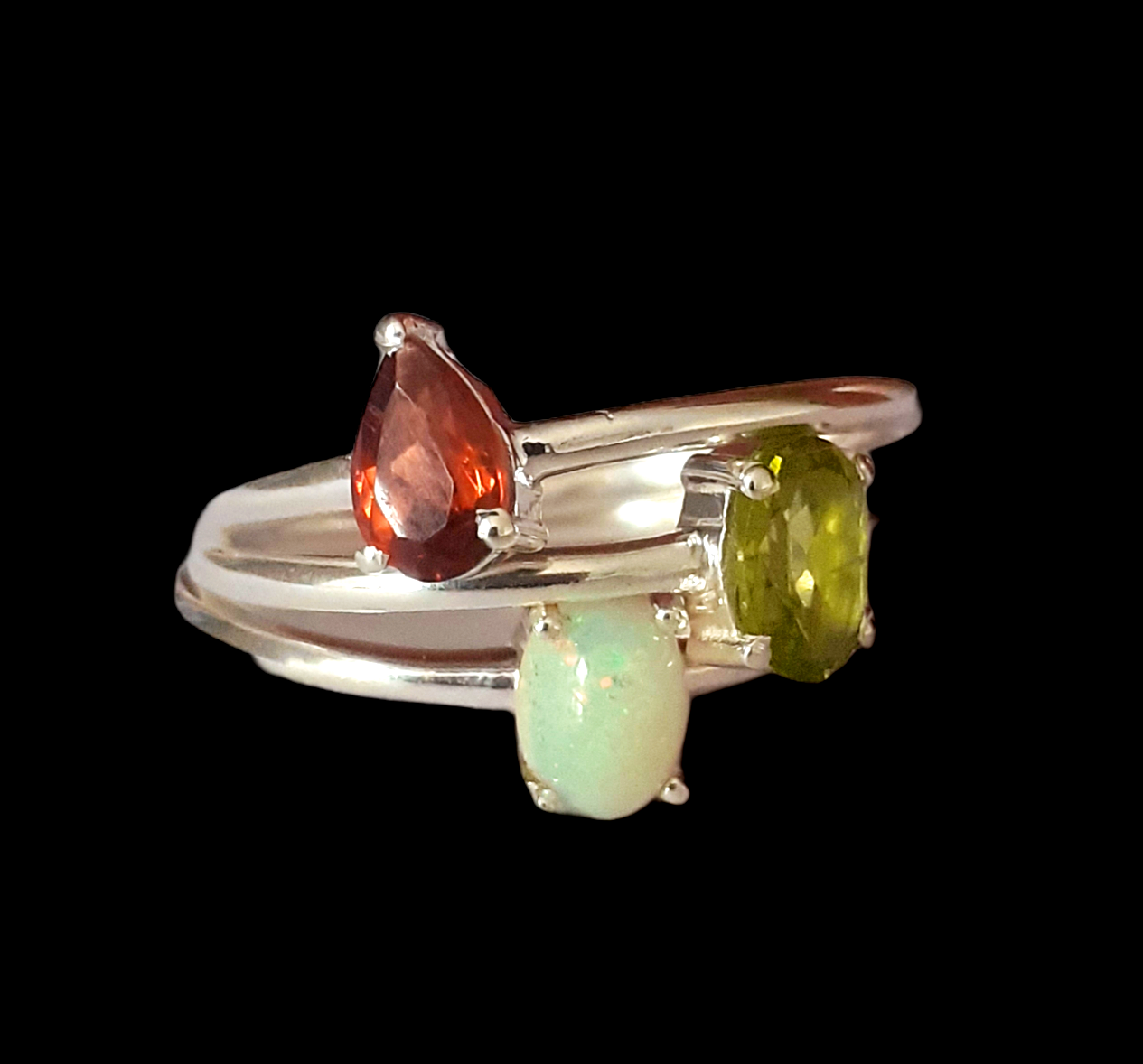 Three 925 silver stacking rings, set with peridot, garnet and opal, (M).