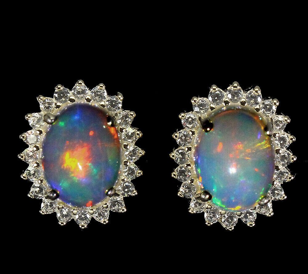 A pair of 925 silver gilt cluster earrings set with cabochon cut opal and white stones, L. 1cm.