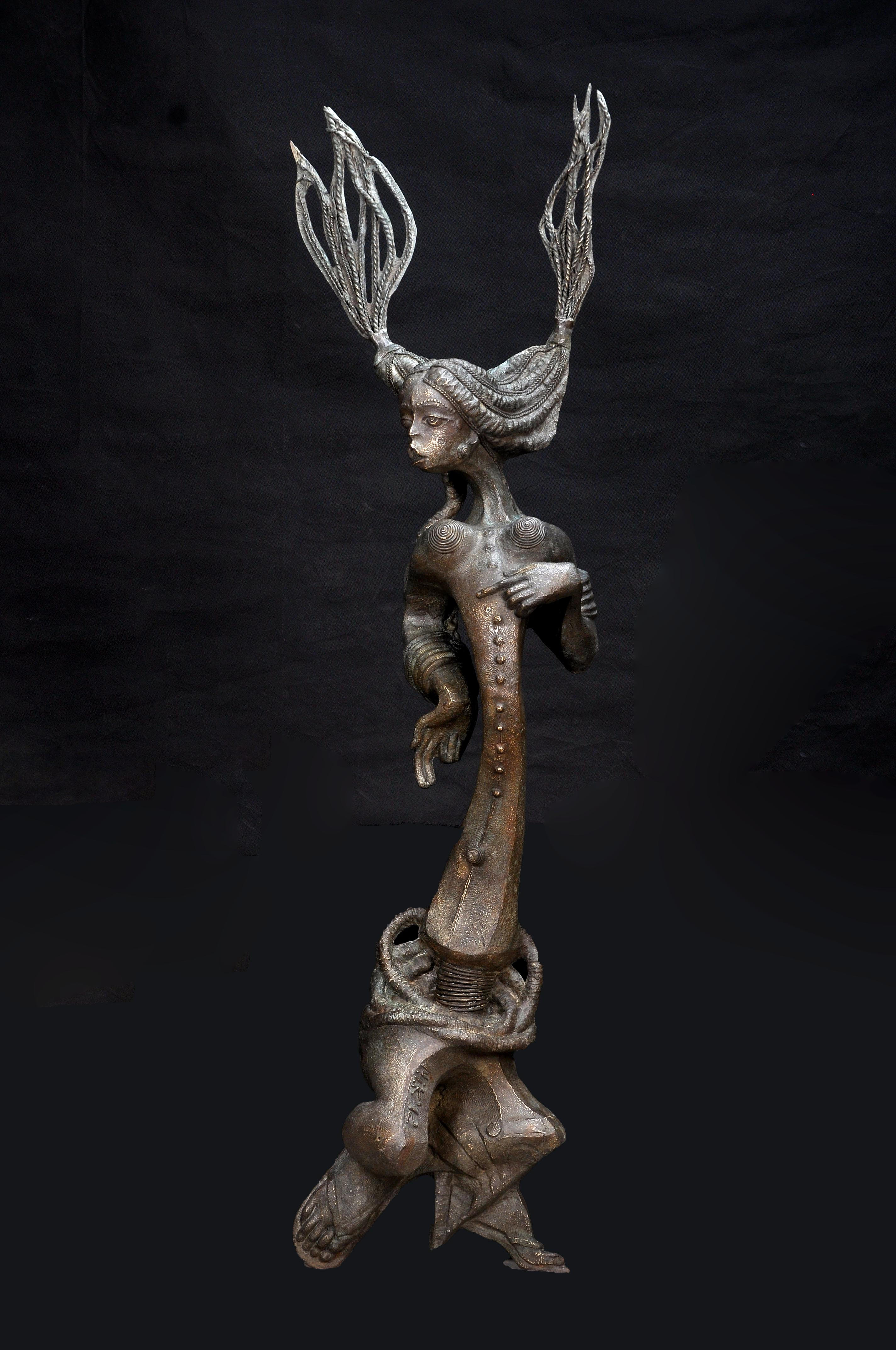 Dr. Njoku Kenneth, "Egedege", bronze sculpture, 153 x 45 x 23cm, 21kg, c. 2012. Egedege brings to