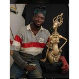 Omodamwen Kelly is a bronze sculptor from Edo state, Nigeria. He explored the use of spark plug as a