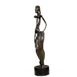 Dr. Njoku Kenneth, "Mma (beauty)", bronze sculpture, 117 x 26 x 30cm, 20kg, c. 2021. Mma presents an