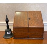 An oak stationary box and a school bell.