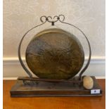 An Oriental brass dinner gong, W. 41cm.