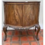 A 1920's walnut veneered two door cabinet, W. 95cm. H. 92cm.