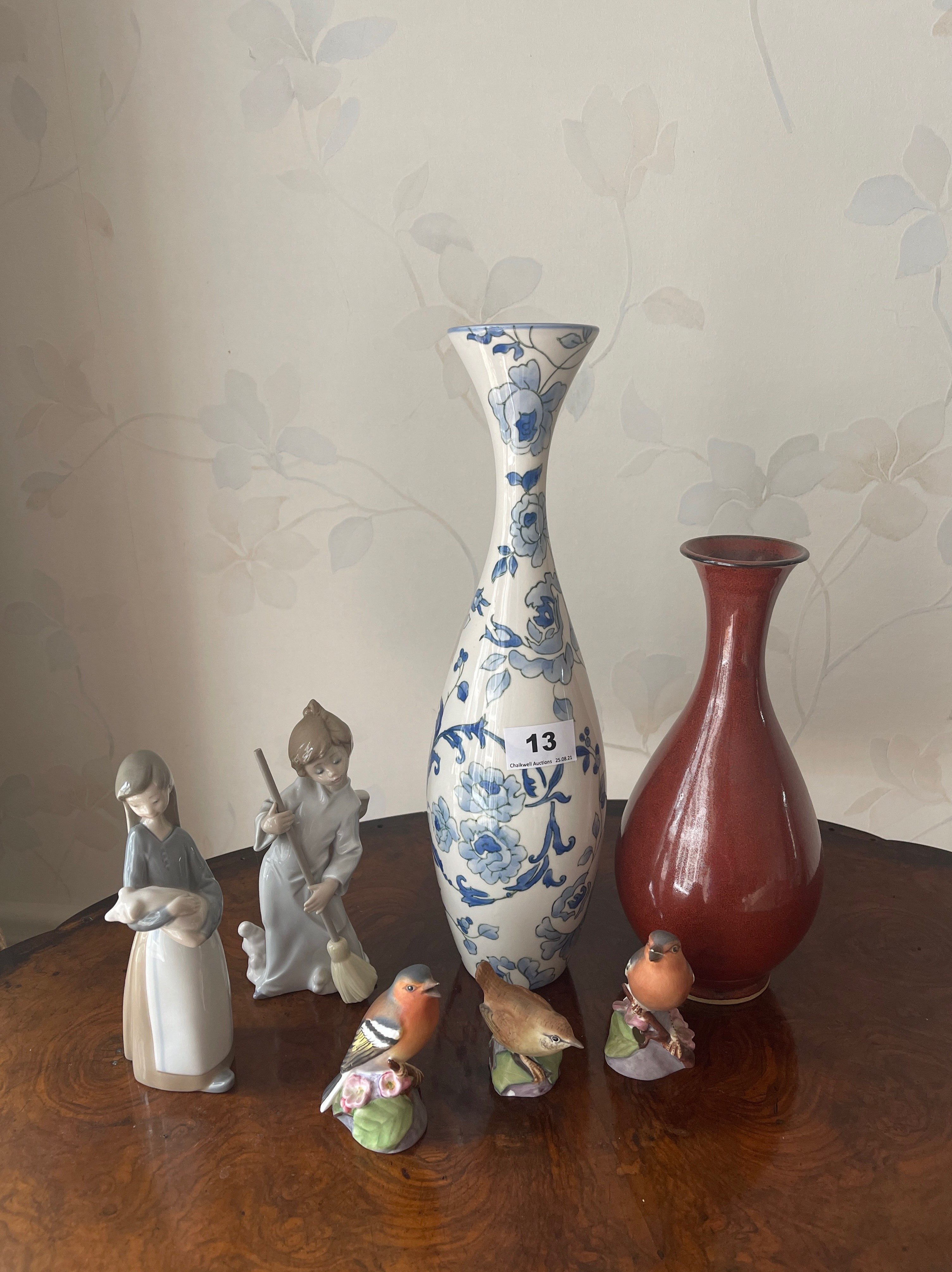 Two Lladro porcelain figurines of children with two porcelain vases and three Royal Worcester bird