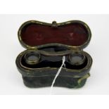 A pair of cased French tortoise shell finished opera glasses, Famille Duchess by J Hirsche Optician,