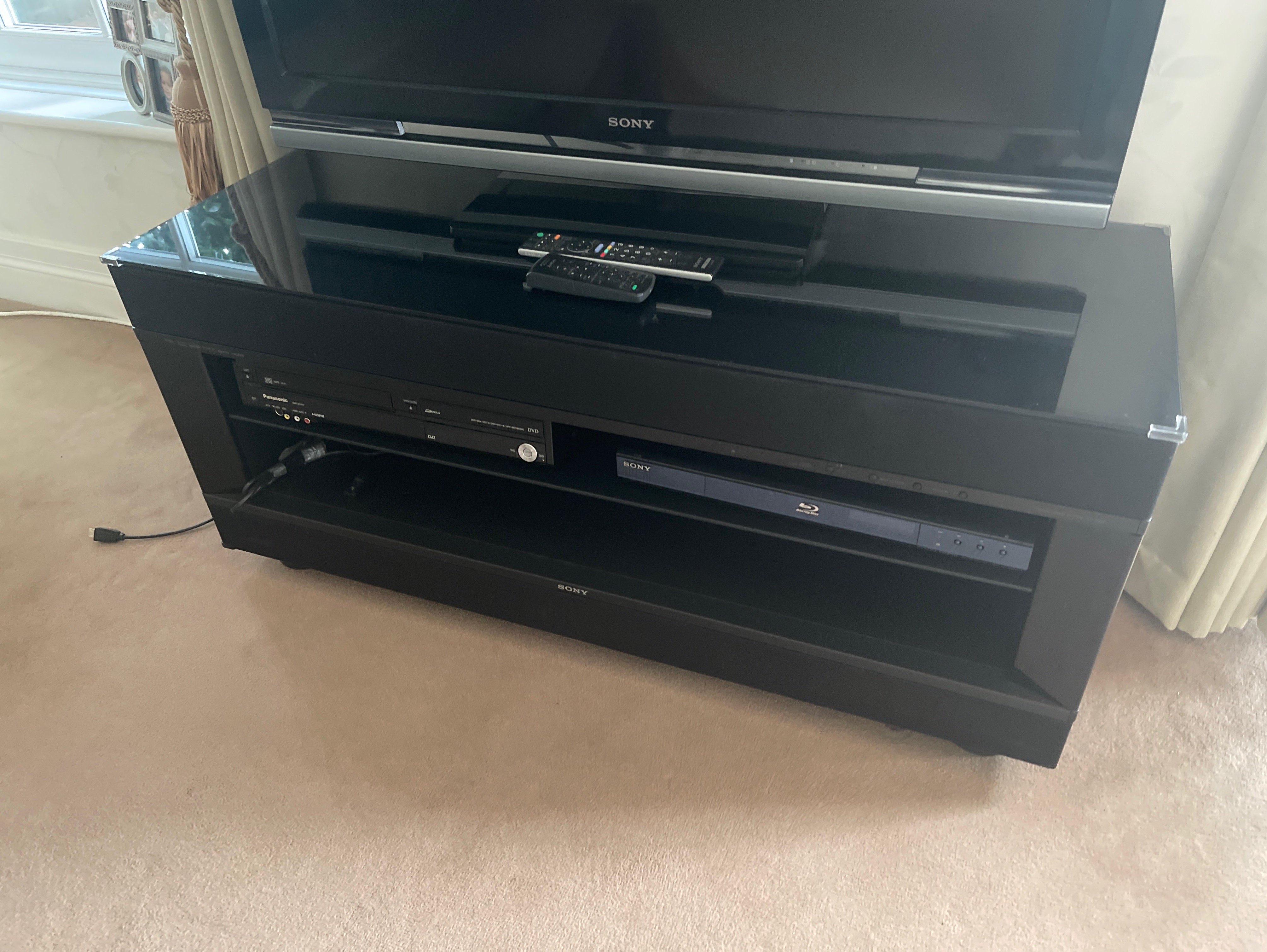 A Sony 42in flat screen television with a Sony Blu Ray disk player, Panasonic DVD player and stand - Image 2 of 2