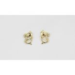 A pair of 14ct yellow gold (stamped 14K) cat shaped diamond set stud earrings, approx L. 1cm.