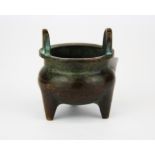 A small 19th C Chinese bronze censer, Dia. 5cm. H. 6cm.